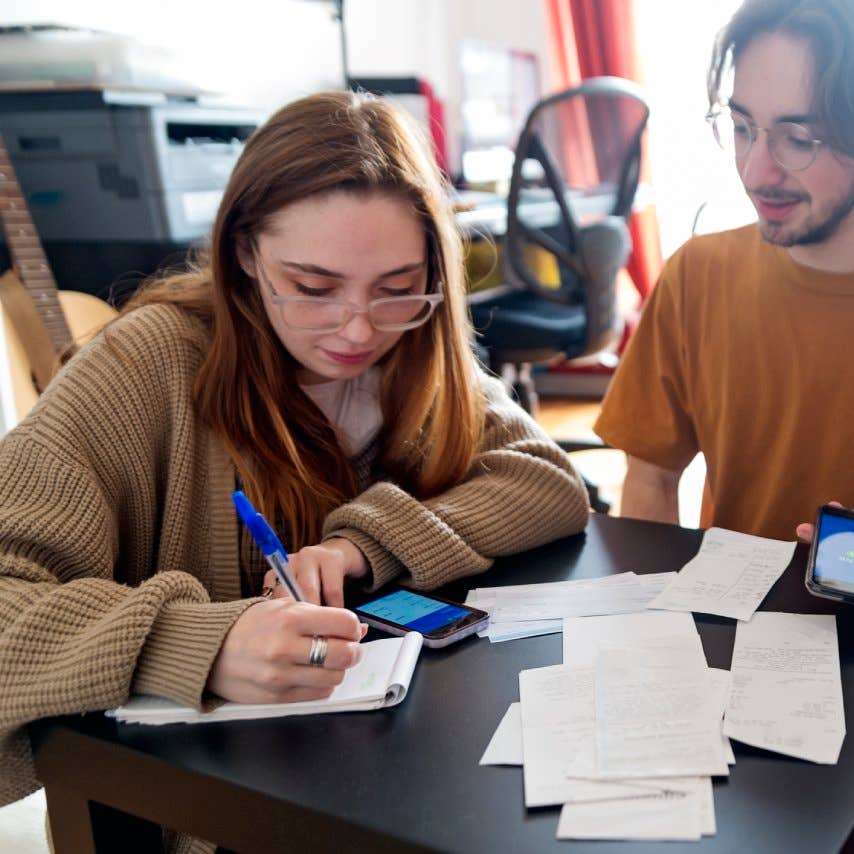 Millennial couple using digital payment to share expense